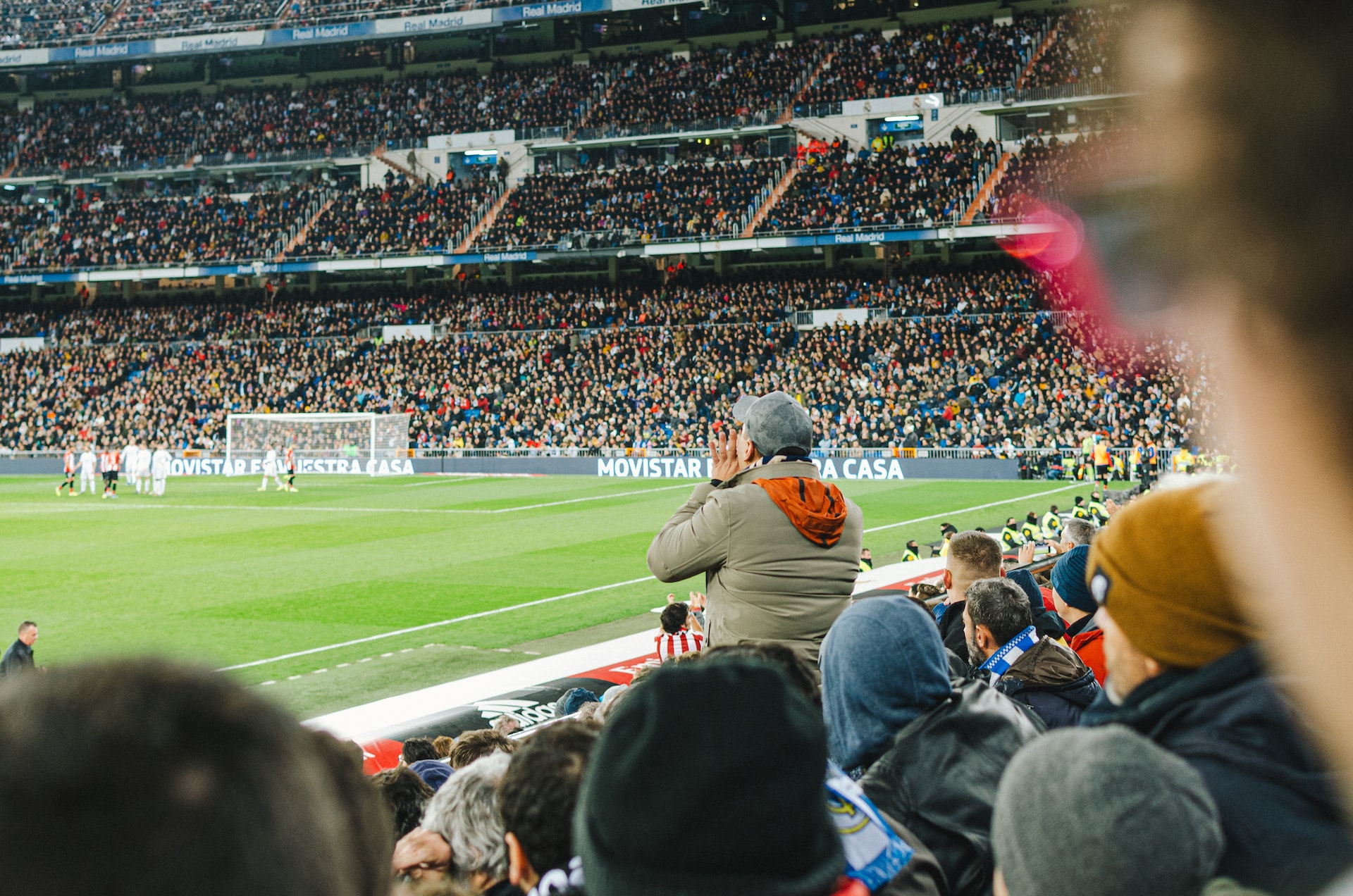 Why Is Sports Betting Popular? Image of a man cheering for his football team
